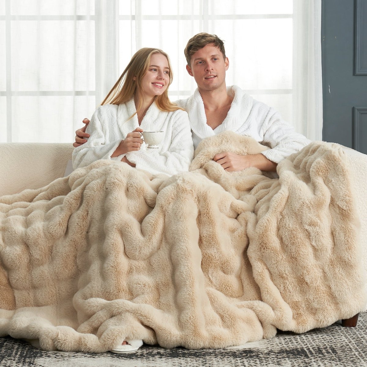 Cozy couple relaxing with soft Cozy Bliss faux fur blanket, cozy and soft blanket #color_Beige