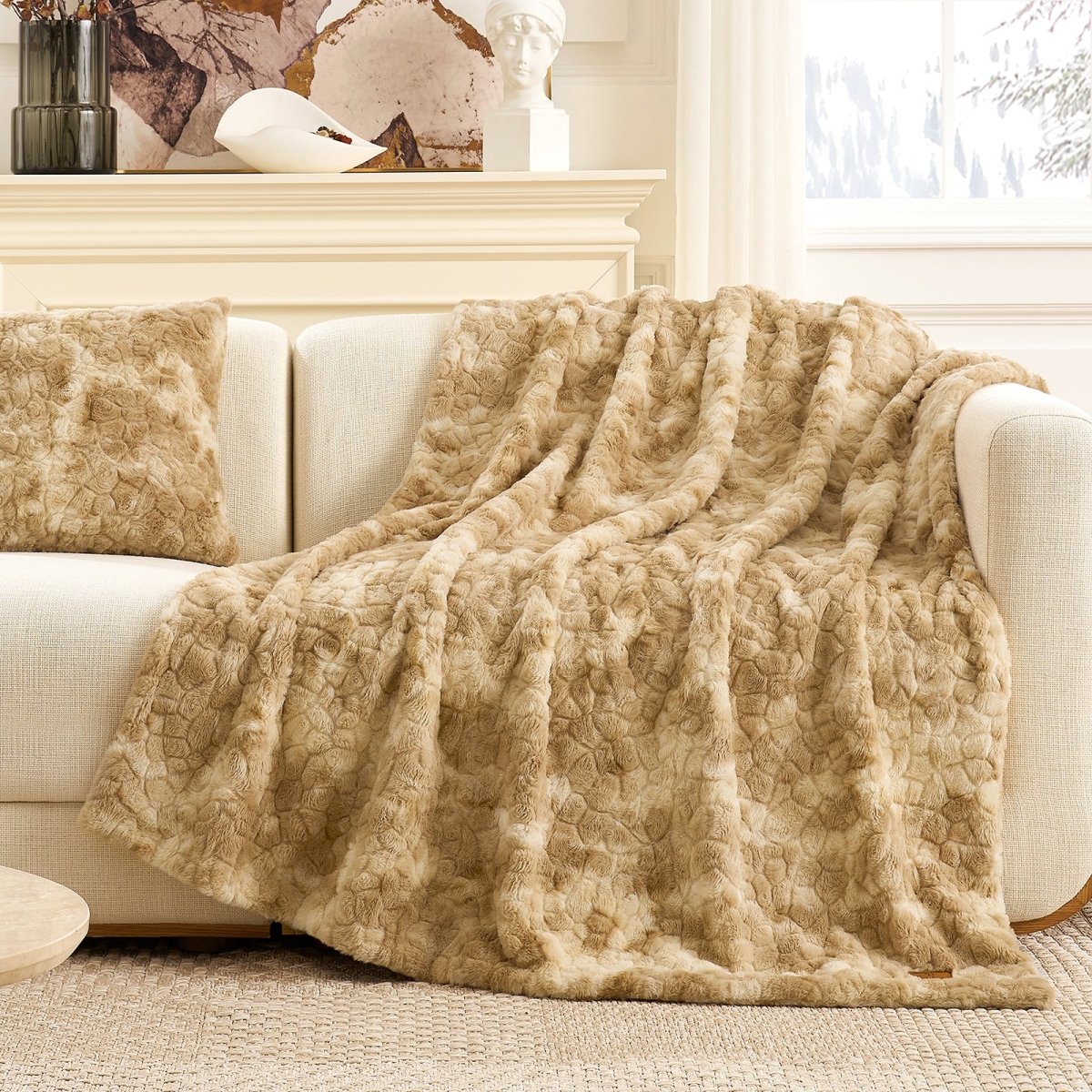 Premium brushed faux fur throw blanket layered over a cream sofa in a warm living room setting #color_Tie-dye Beige