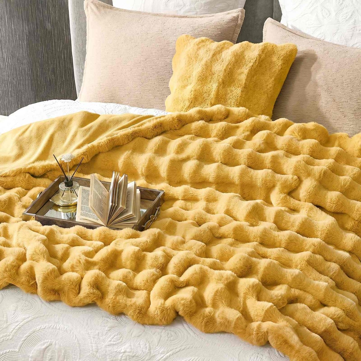 Yellow Cozy Bliss faux fur throw blanket on bed. Cozy and soft blanket for bedroom comfort#color_Yellow